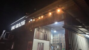A rustic building with a sign reading "THE GRAZIE" and a wooden facade. - BanGoDangtia (Pak Chong)
