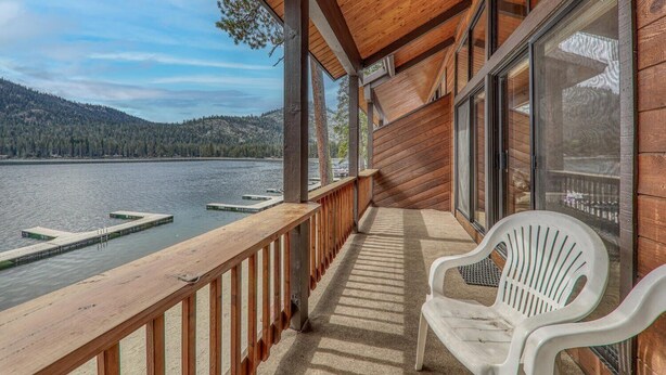 A wooden deck with a view of a lake and mountains. - 254 Bldg D 2 Bedroom Townhouse (Truckee)