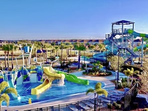 A water park with multiple slides and a pool area.