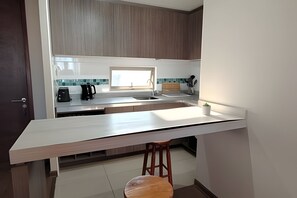 Apartment | Private kitchen - Oceana Suites Concepto One (Calama)