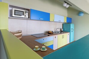 Fridge, toaster, high chair, cookware/dishes/utensils