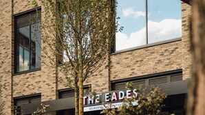 A building with a sign reading "THE FADE'S" and a brick facade. - The Eades Laura Perryman 1 Bed (London)