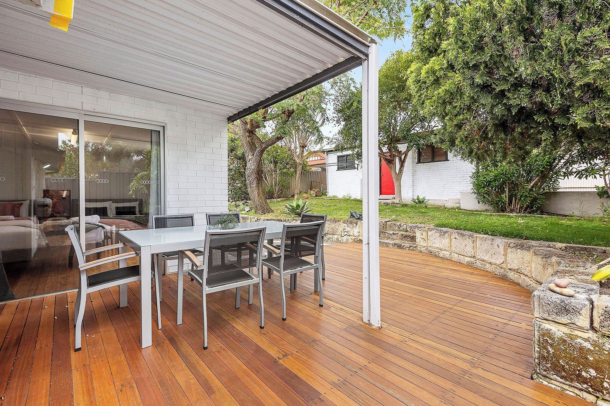 Outdoor Oasis! Relax or dine on the expansive covered deck, offering a perfect spot to enjoy the fresh air and backyard greenery.