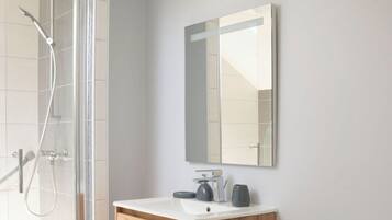 Shower, hair dryer, towels, soap