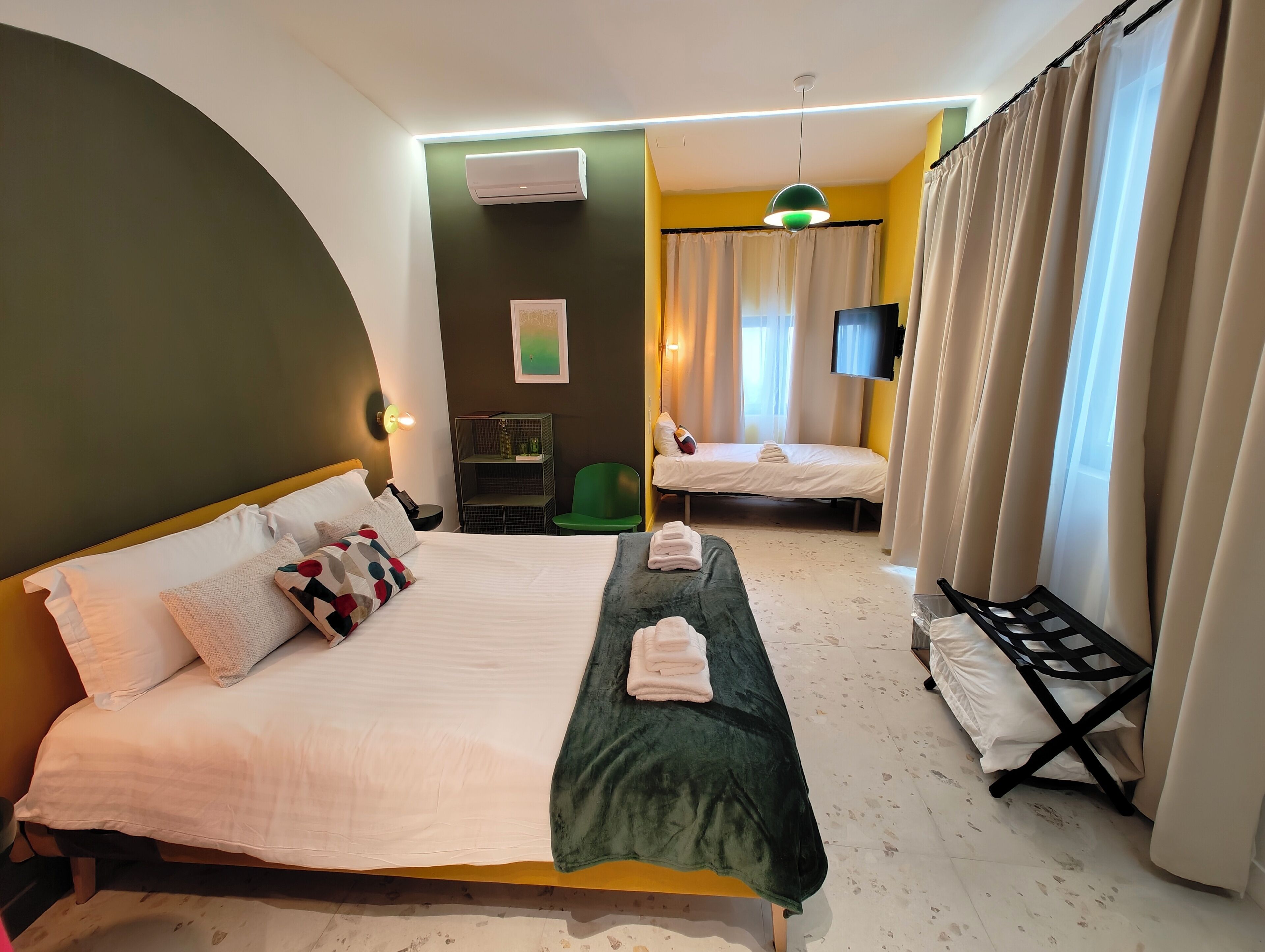 Family Room, Balcony, Garden View | Soundproofing, iron/ironing board, free WiFi, bed sheets