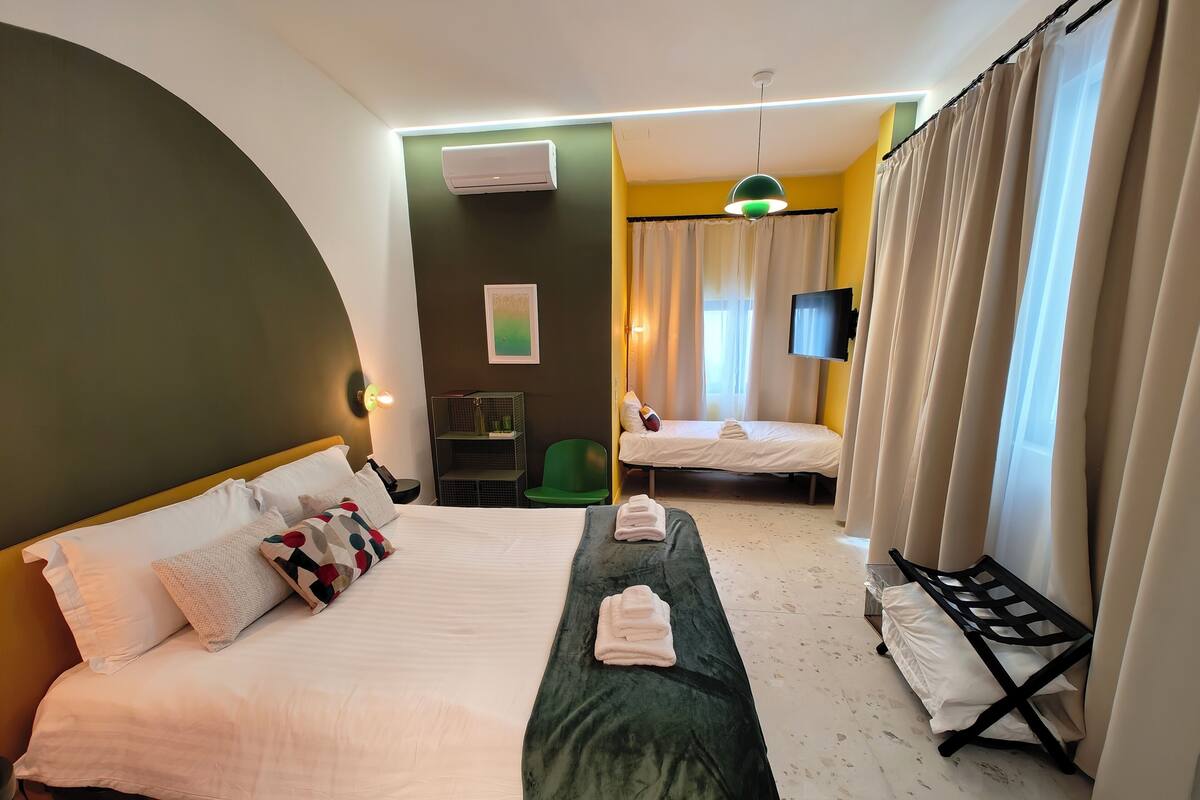 Family Room, Balcony, Garden View | Soundproofing, iron/ironing board, free WiFi, bed sheets