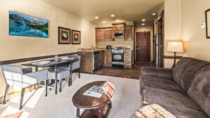 A modern kitchen with wooden cabinets, a built-in microwave, and a dishwasher. - 1 block from Park City Mountain with hot tub Managed by Park City Lodging (Park City)