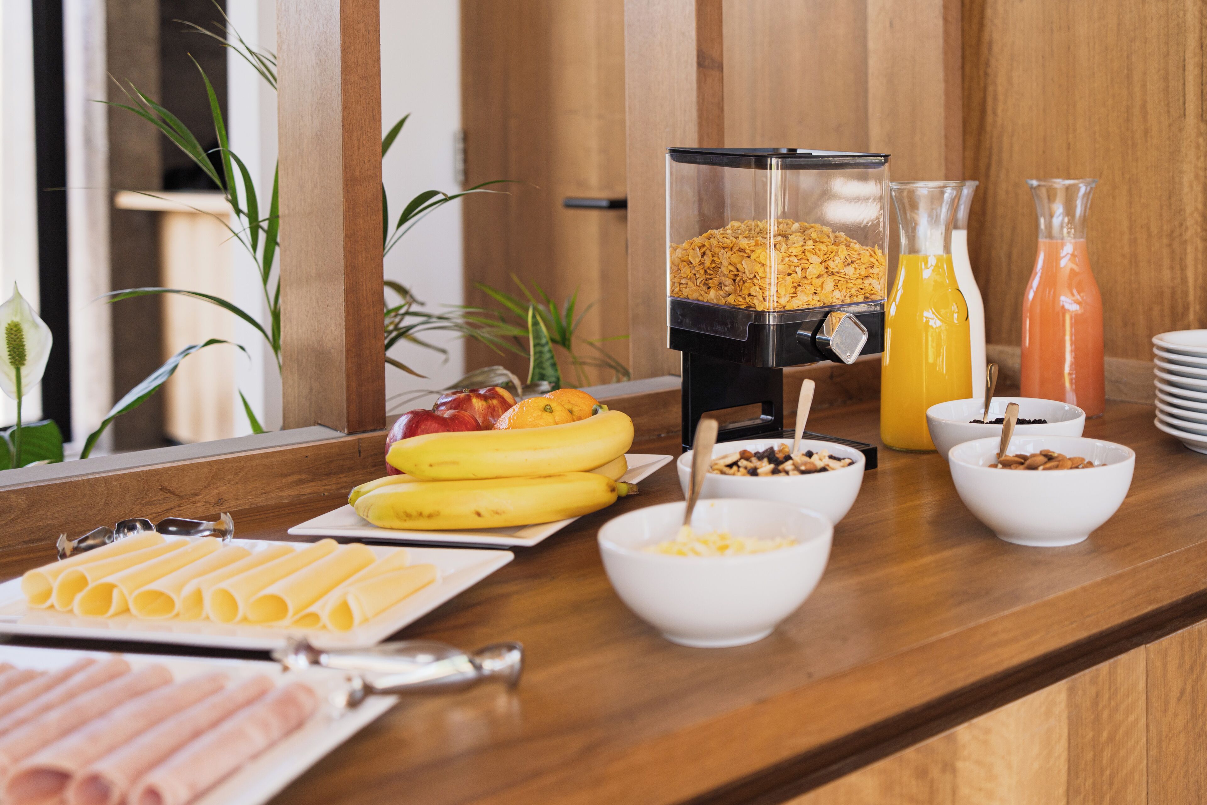 A breakfast buffet with various food items and beverages.