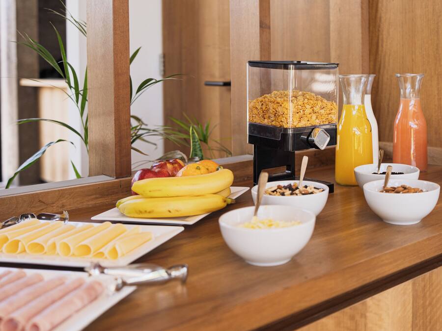 A breakfast buffet with various food items and beverages.