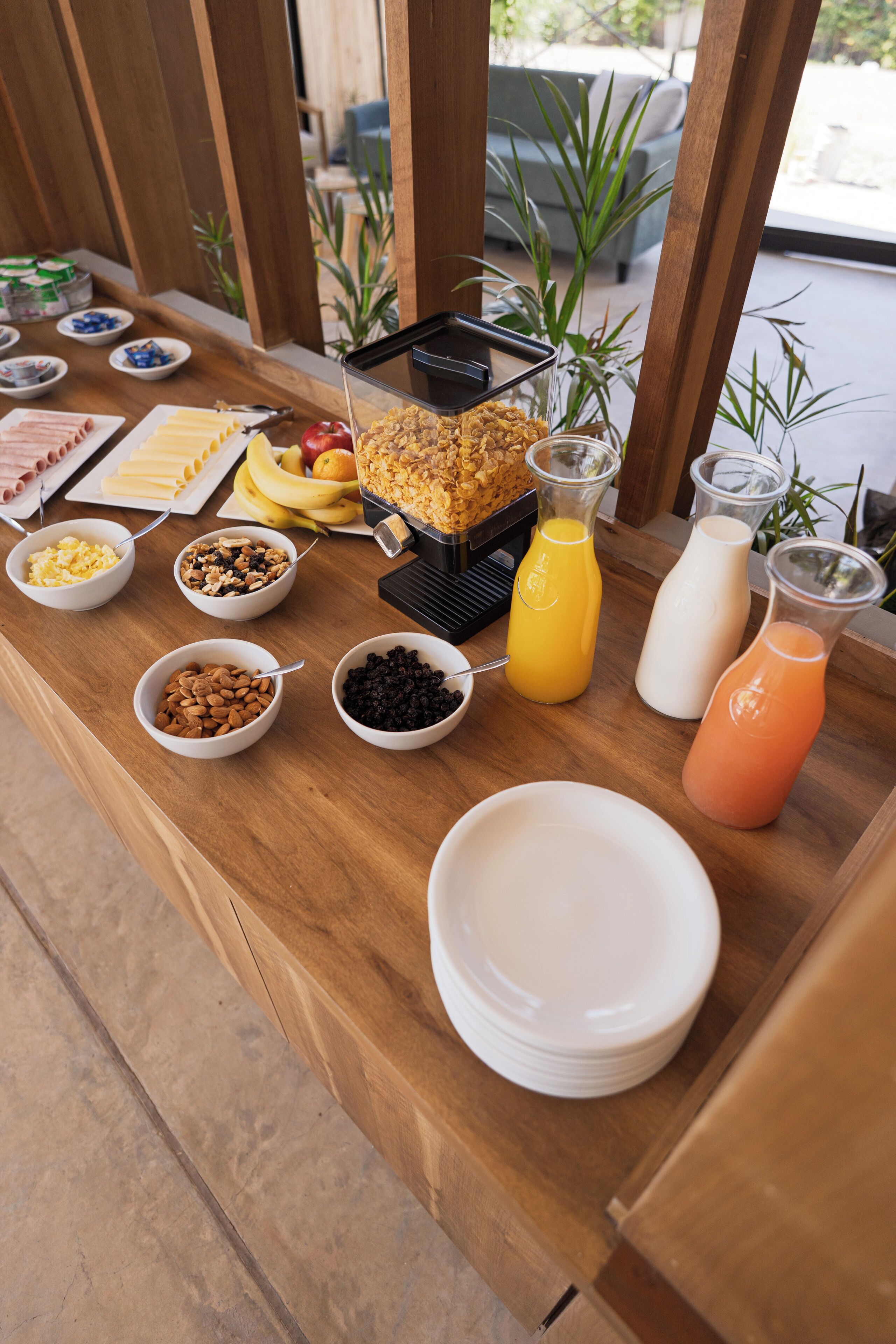 A breakfast buffet with various food items and beverages.