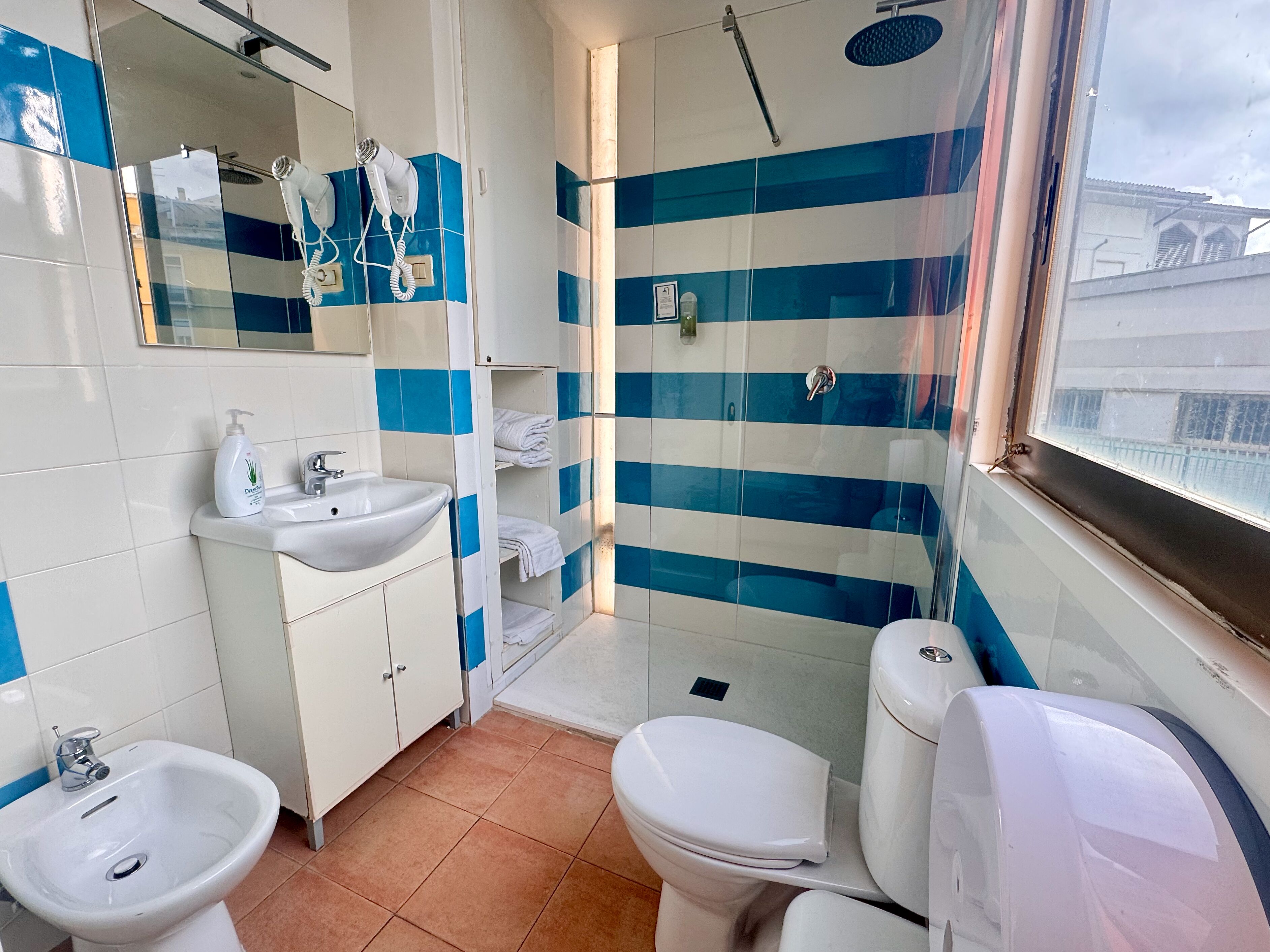 Triple Room, City View | Bathroom | Shower, free toiletries, hair dryer, towels