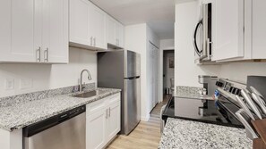 Private kitchen - Landing | Modern 2BD, Pool, Tennis Court (DeSoto)