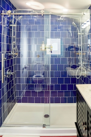 Shower, hair dryer, towels, soap. The Clark: Our vision of Clark Kent's 1st home with full kitchen & laundry!!!