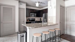 Fridge, dining tables - Landing | Stylish 2BD, Gym (Houston)