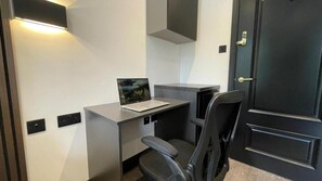 Deluxe Double Room, City View | Desk, laptop workspace, soundproofing, iron/ironing board