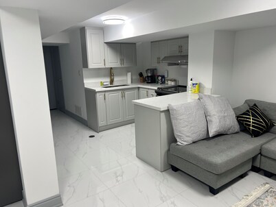 Stylish 1BR + Den Apartment | Sleeps 5 | Separate Ent. & Comfort with Parking