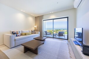 Apartment, 1 Bedroom, Sea View | Living area | 32-inch LCD TV with cable channels