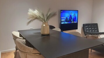 Superior Apartment | Living area | 55-inch Smart TV with digital channels, Netflix, streaming services