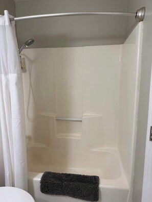 Shower, hair dryer, towels, shampoo