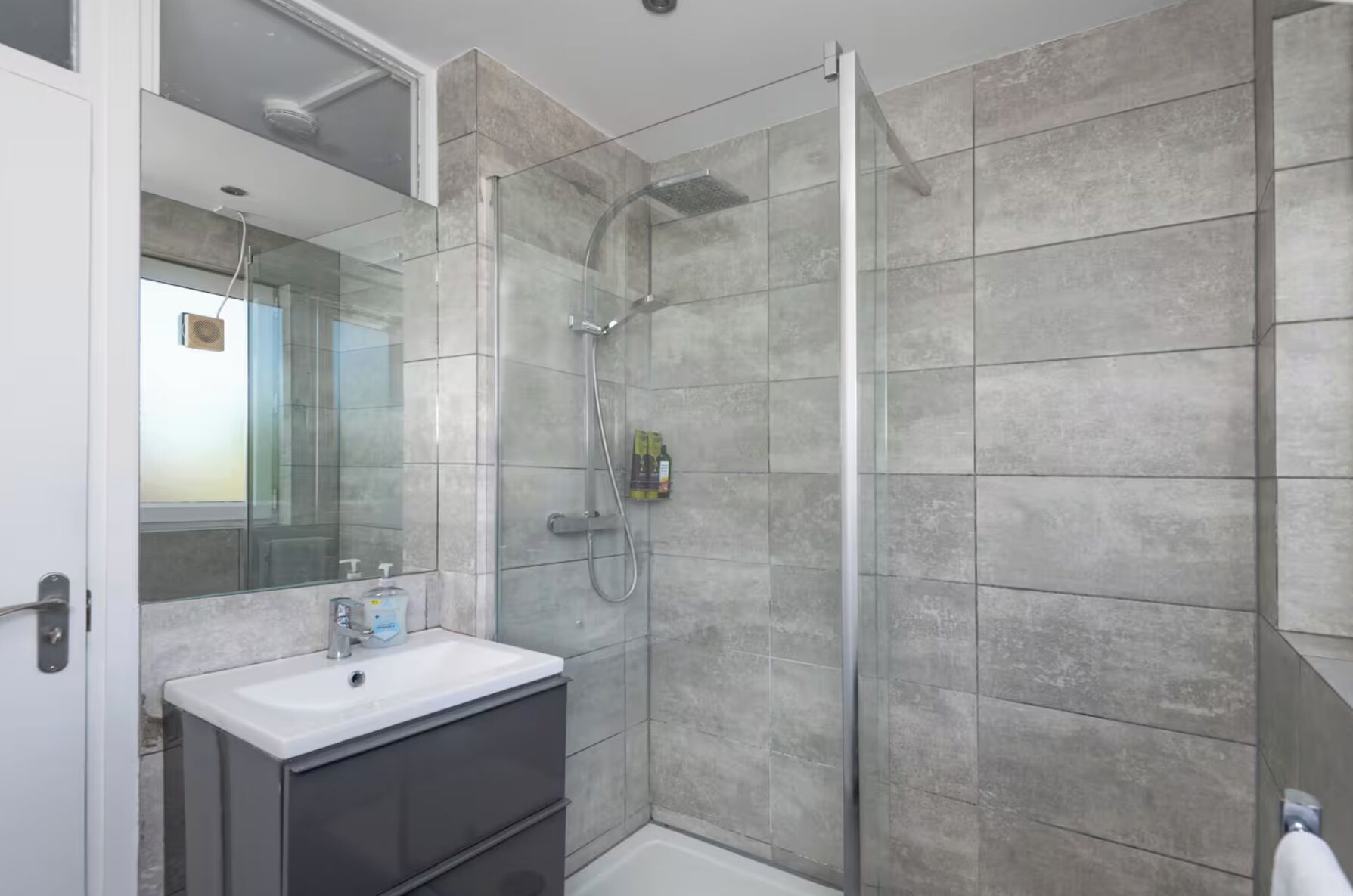 Shower, hair dryer, towels, toilet paper