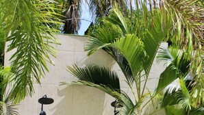 A tiled wall with two black outdoor shower heads. - Luxury 2BR apartment steps from the beach (Punta Cana)