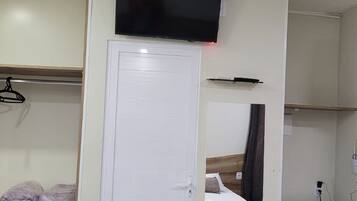 Economy Triple Room | Bathroom | Shower, hair dryer, towels, soap