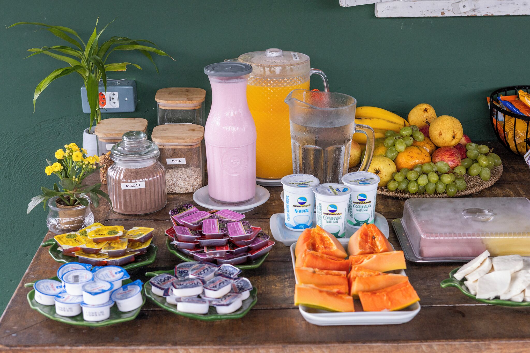 A breakfast buffet with various food items and beverages.