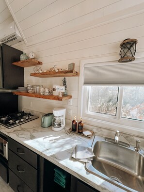 Fridge, microwave, stovetop, coffee/tea maker