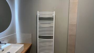 Shower, hair dryer, towels, toilet paper