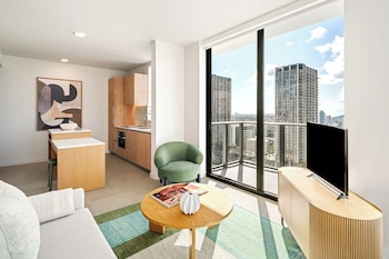 65-inch flat-screen TV with cable channels at The Crosby Miami Worldcenter