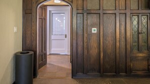 A wooden door with a glass panel and a small sign. - The Estuary Indy - Your Private Sanctuary! (Indianapolis)