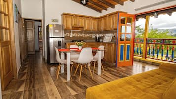 Deluxe Apartment, Balcony, City View | Dining room