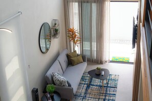 Deluxe Apartment, Patio | Living area