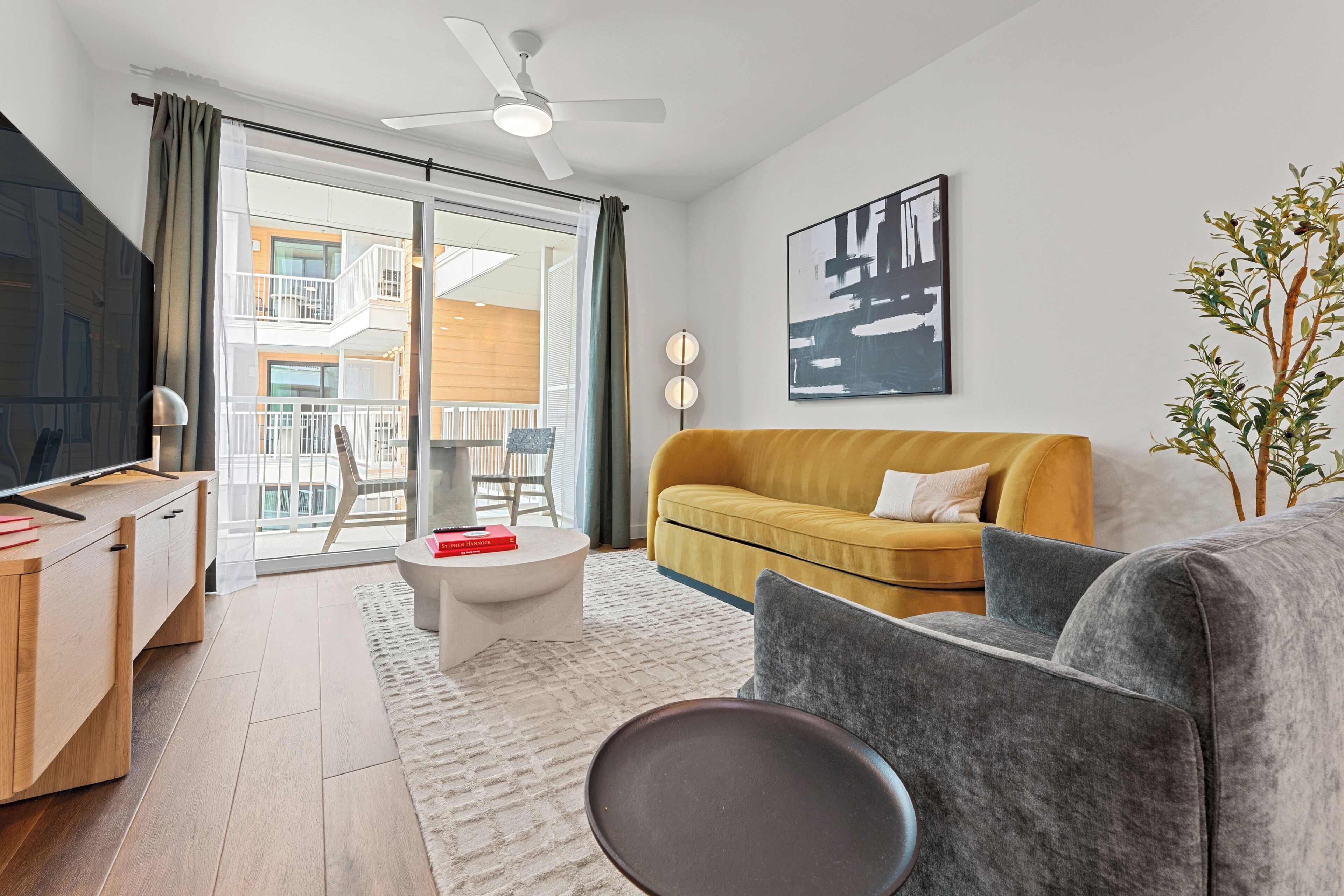 1 Bedroom Executive Suite w/ Balcony | Living area | 55-inch Smart TV with digital channels