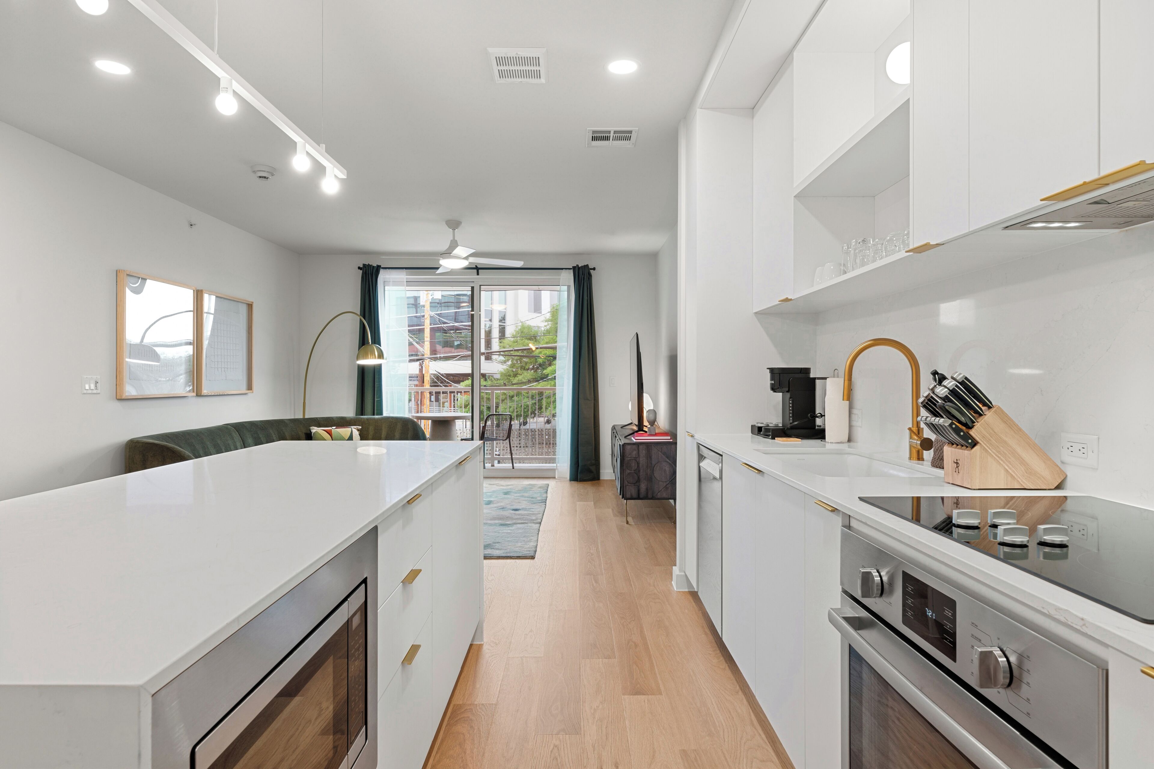 2 Bedroom Deluxe Suite w/ Balcony | Private kitchen | Coffee/tea maker, fridge, microwave, oven