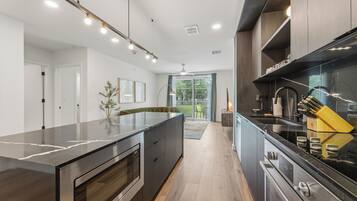 2 Bedroom Deluxe Suite w/ Balcony | Private kitchen | Fridge, microwave, oven, stovetop