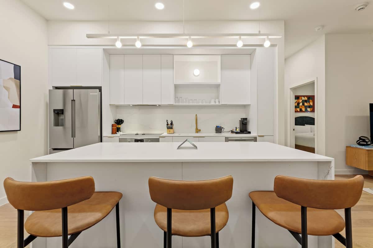 1 Bedroom Executive Suite w/ Balcony | Private kitchen | Fridge, microwave, oven, stovetop