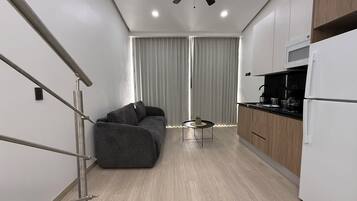 Comfort Studio, City View | Living area | 40-inch TV with satellite channels