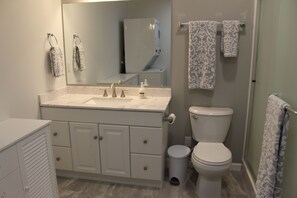 Shower, towels, soap, toilet paper