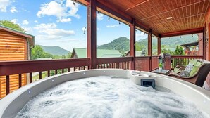 A hot tub in a wooden deck with a view of mountains. - Watch the Elk from the Deck! Hot Tub, High Speed Wifi, Paved Access (Maggie Valley)