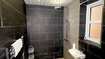 Shower, hair dryer, towels, soap
