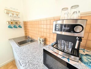 Fridge, microwave, stovetop, coffee/tea maker
