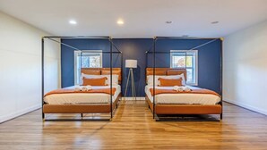 A room with two beds, each with a canopy, a standing lamp, and a window. - 
Spacious 5-Bedroom Retreat Minutes from Washington (Virginia)