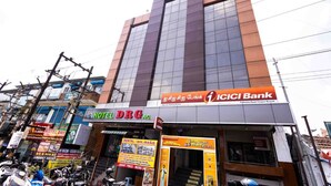 A building with a sign for ICICI Bank and HOTEL DRG. - Hotel DRG Classic (Tirupur)
