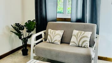 Studio Deluxe, vue jardin | Coin séjour