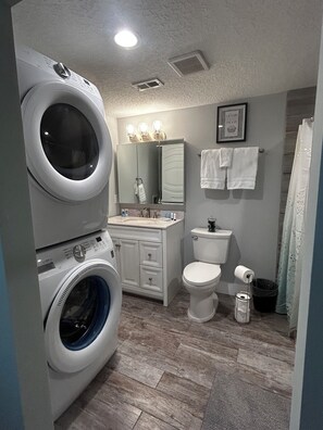 Shower, hair dryer, towels, soap