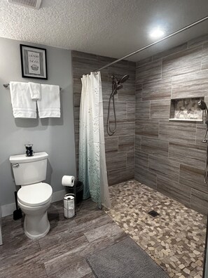 Shower, hair dryer, towels, soap