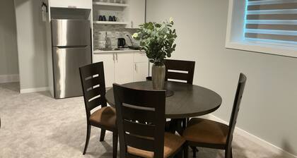 "Modern 2BR Suite with Private Entrance, Workspace, A/C & Parking in Sage Creek"