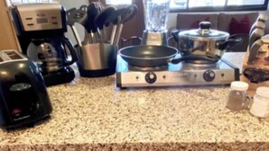 A kitchen with a granite countertop, a coffee maker, a toaster, a blender, a frying pan, and a small refrigerator. - Welcoming studio with access to Sundance Film Festival, ski resorts in Park City (Park City)