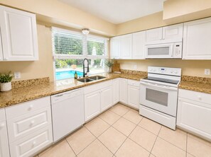 Coffee/tea maker, fridge, microwave, oven